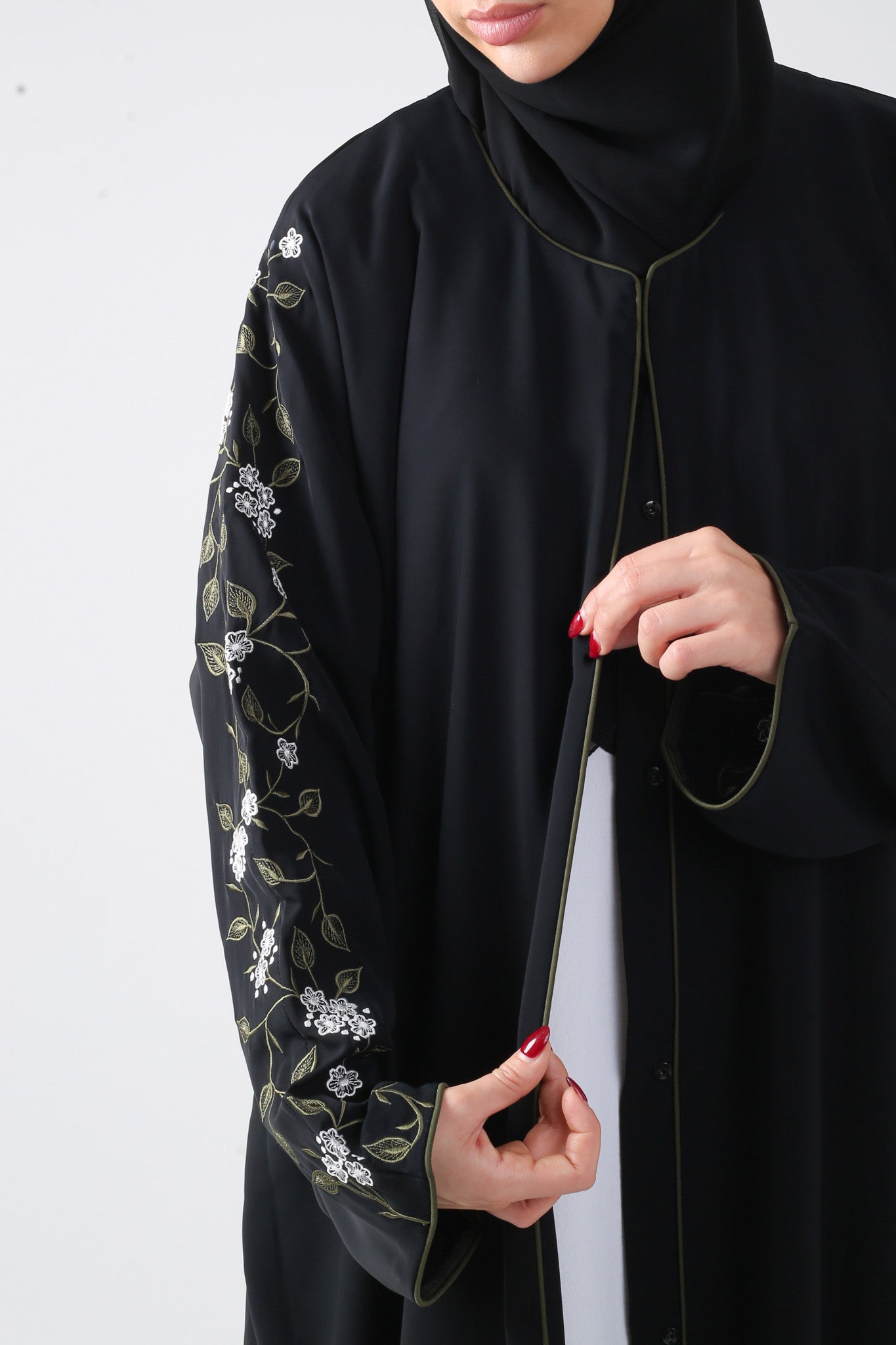 close up view of right sleeve of black batwing abaya