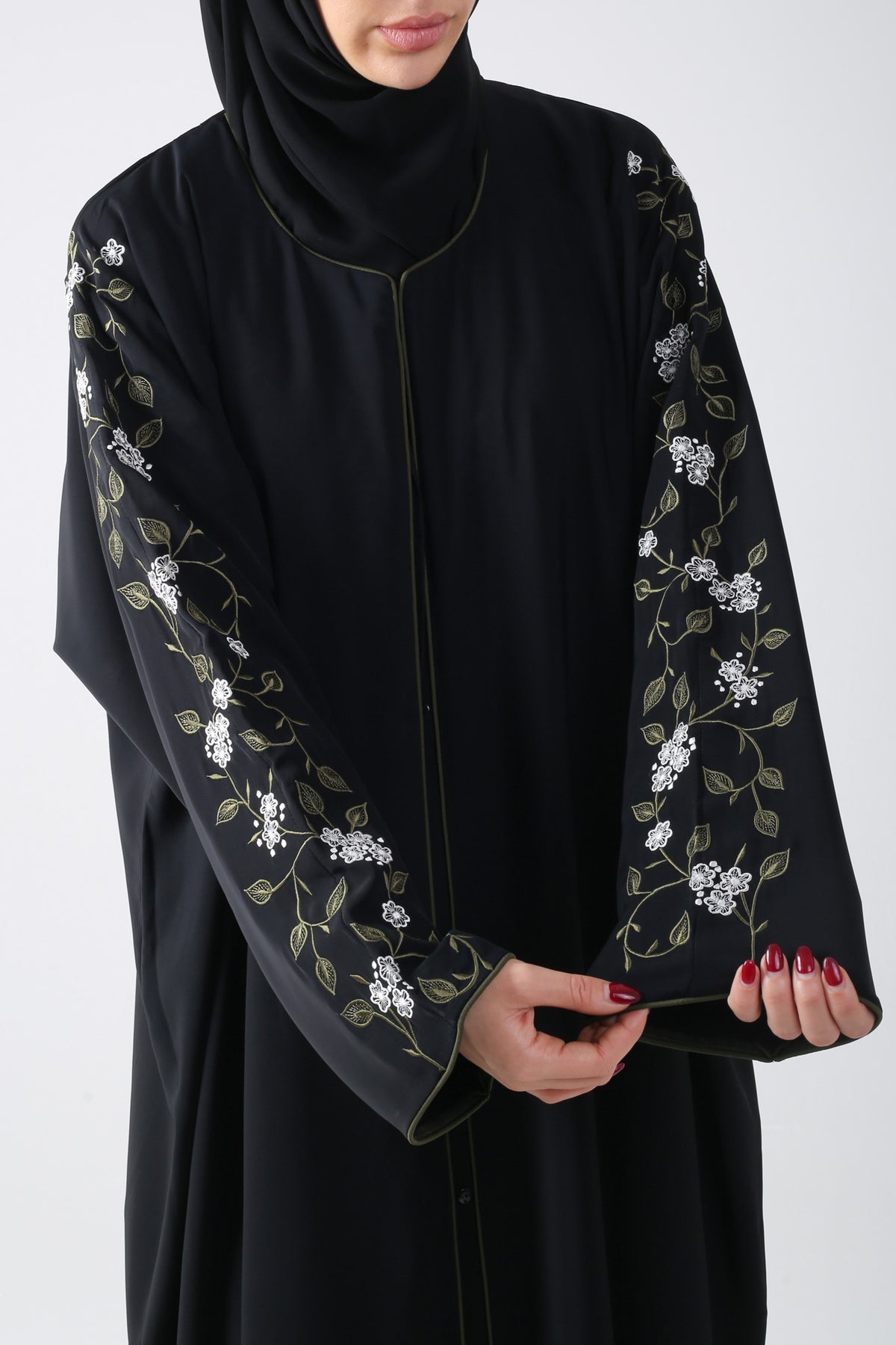 closeup view of black batwing abaya with embroidery on sleeve