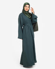 Plain linen dark green closed abaya with split cuffs side view