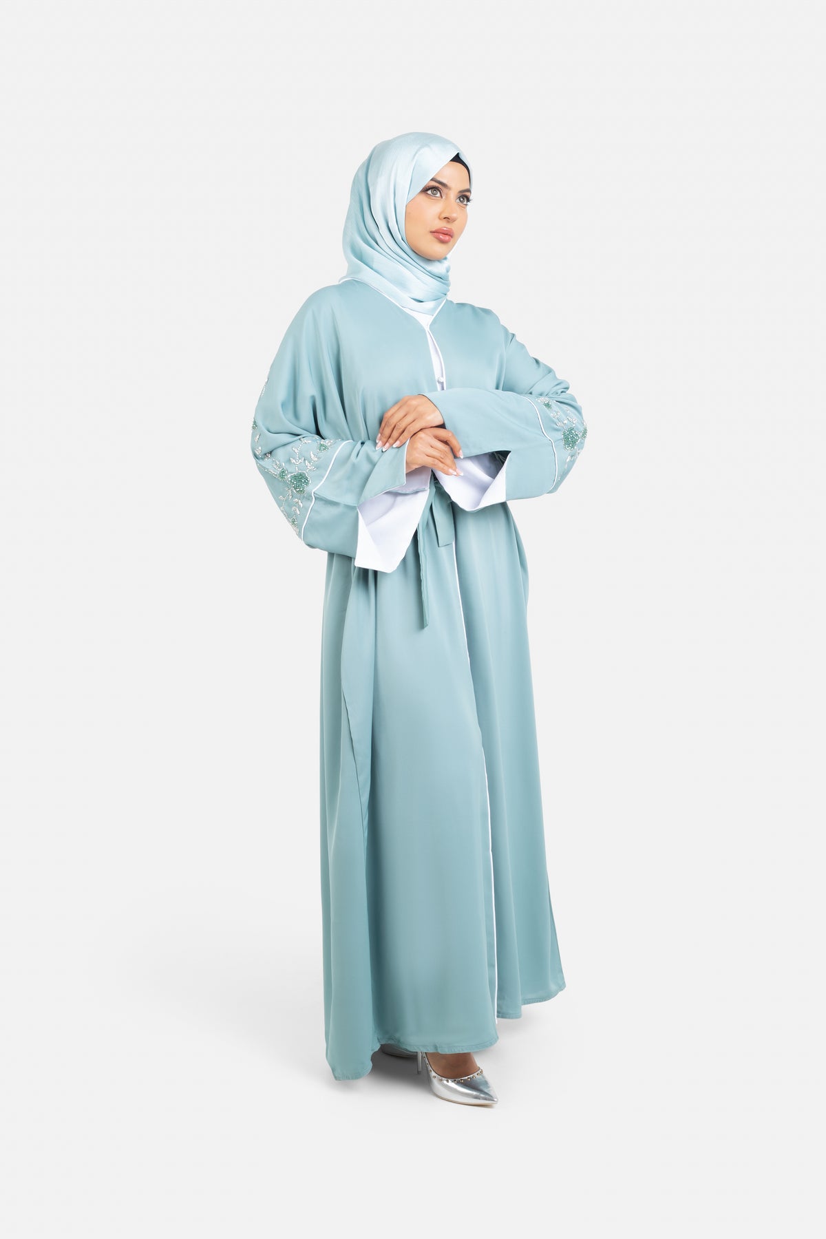 Sage green embellished abaya with split cuffs side view