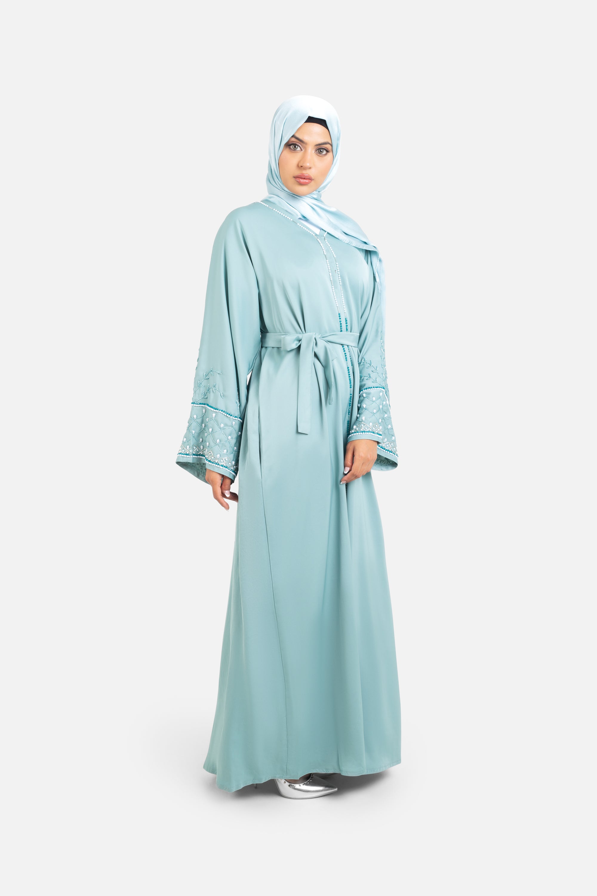 Sage green open abaya with detailed embellishments front view