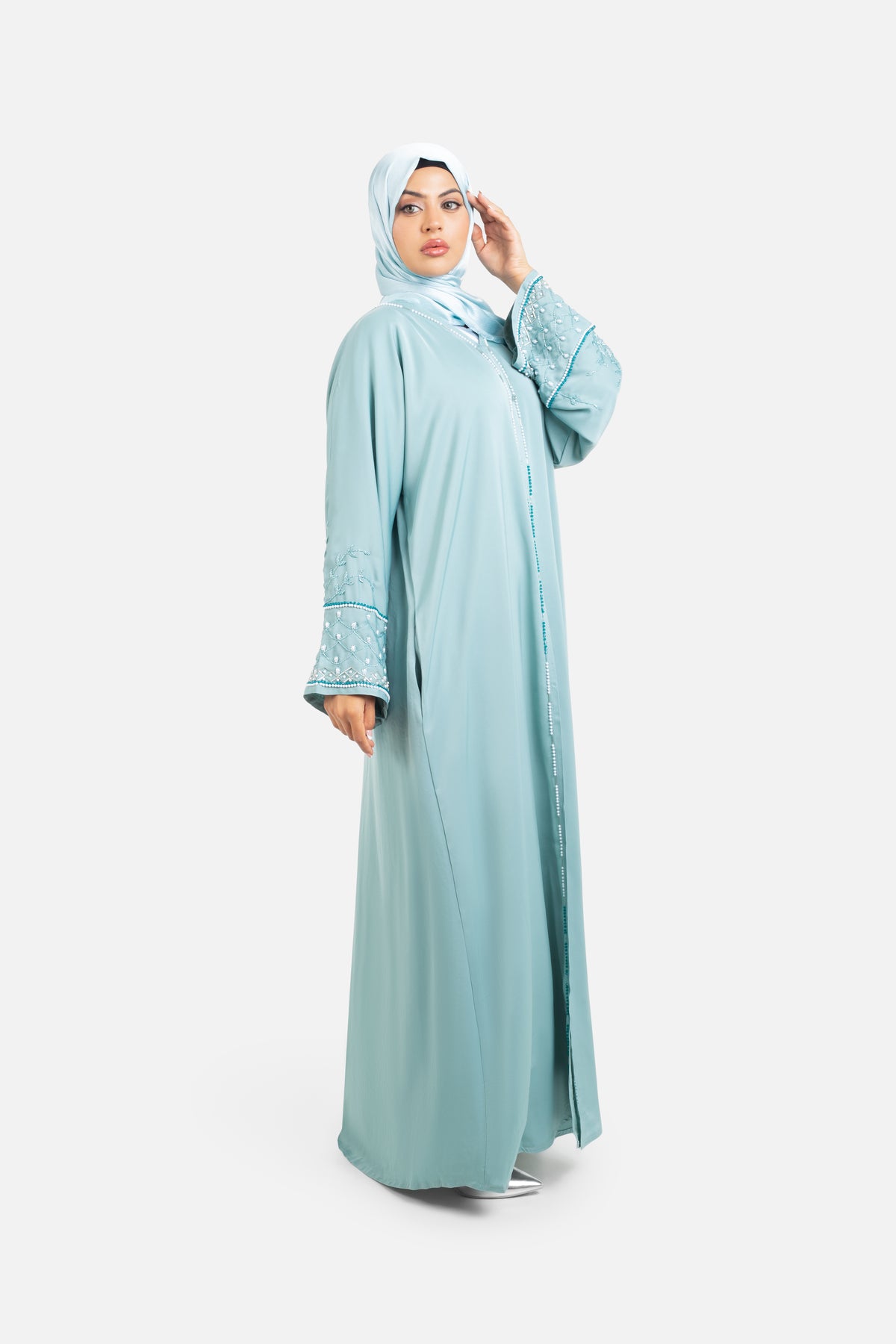 Sage green open abaya with detailed embellishments front side